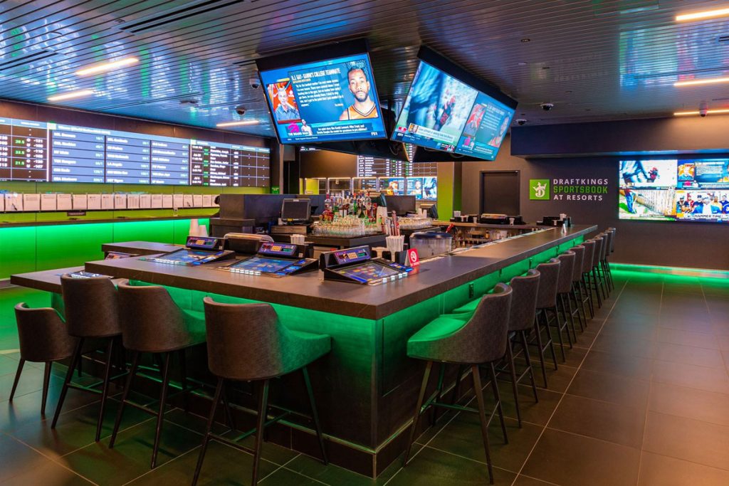 Modern sports betting bar with screens.