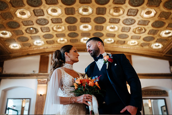 people in a wedding venue with flowers